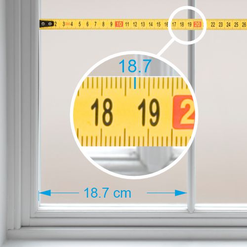 Using a tape measure on glass.