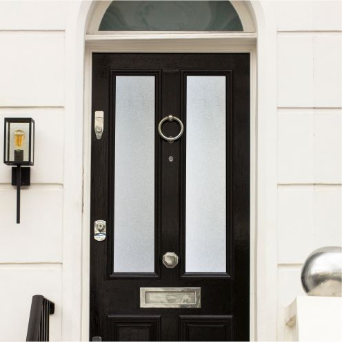 Frosted window film on a black front door