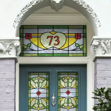 Stained glass window film on a front door with house number