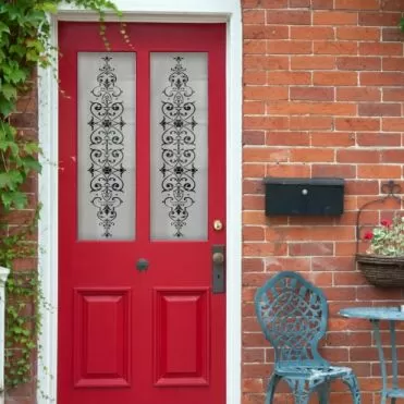 Victorian etch effect window film on a red front door